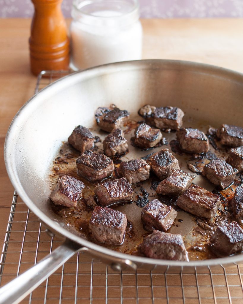 a pan with meat in it